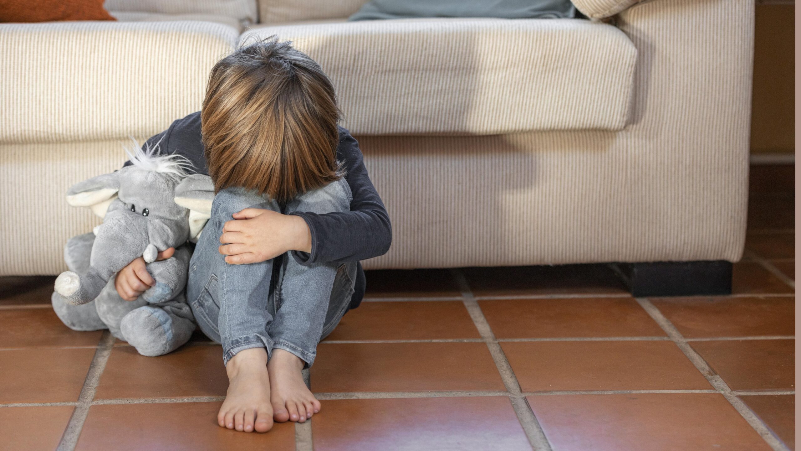 little-boy-outdoors-upset-holding-his-toy (2)